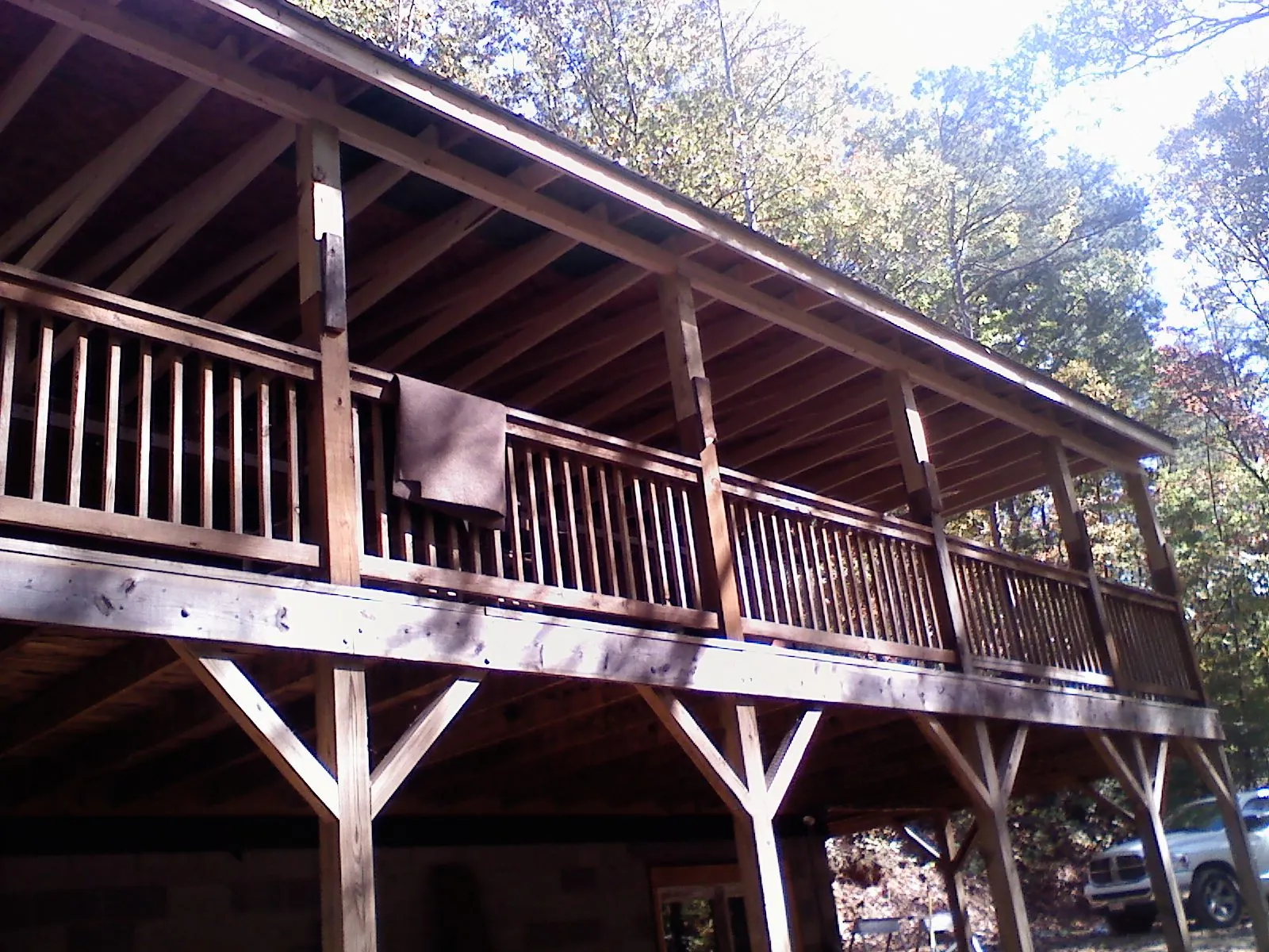 Timber framing under a new elevated porch and deck — Roof Leak Repair in Fort Collins by Roofing Brothers